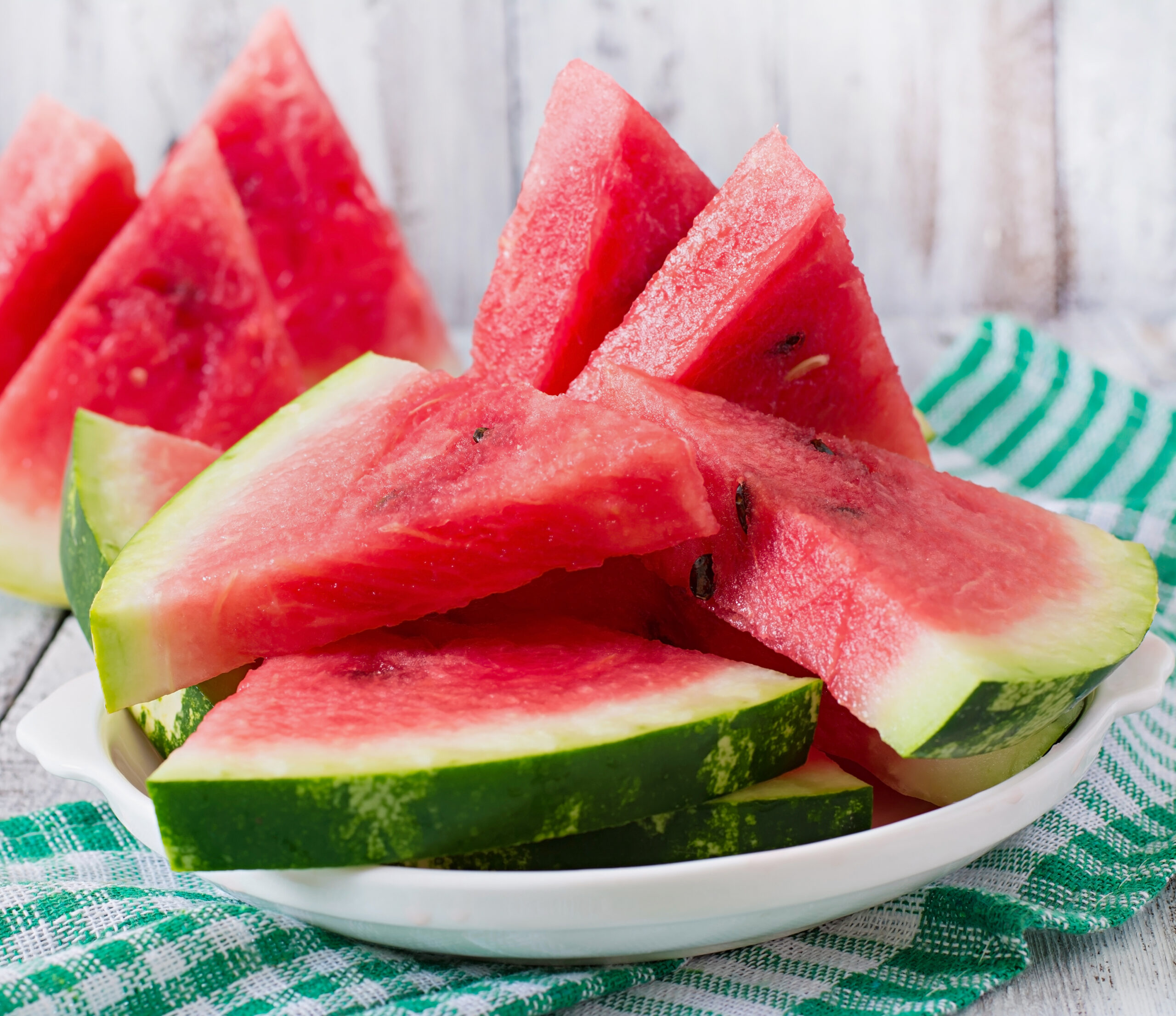 slices juicy tasty watermelon white plate scaled